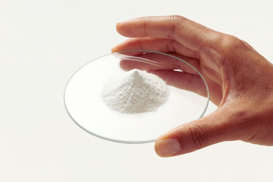 a hand holding powder to test